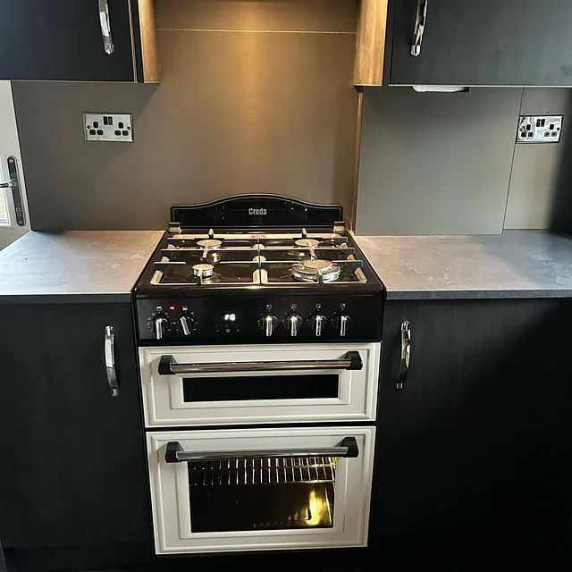 black kitchen with cooker