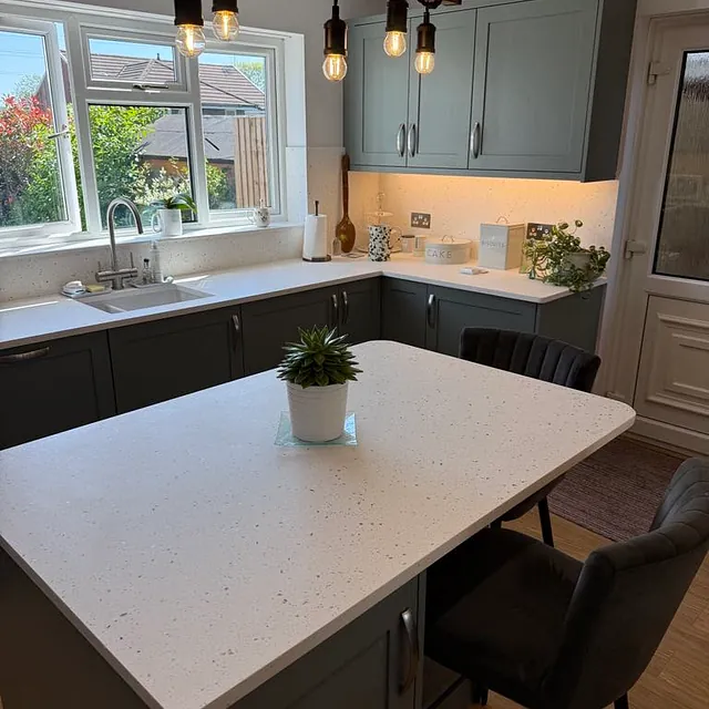 pale green kitchen with table